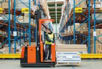 Forklift driver in warehouse